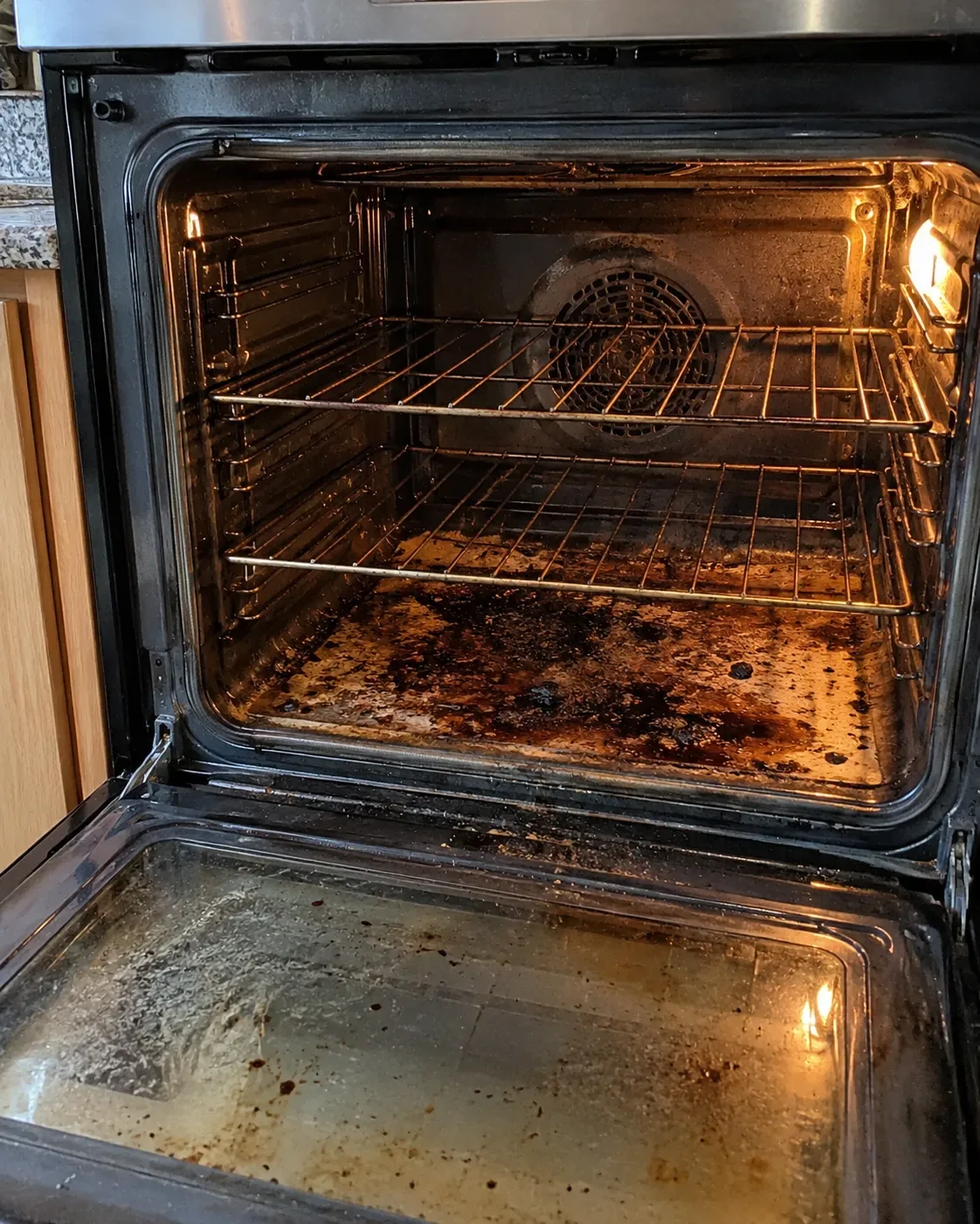 Close-up of oven controls and door in an everyday residential kitchen